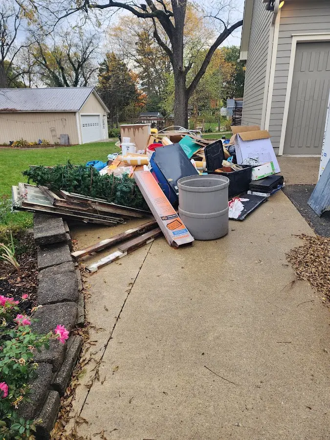 Dumpster being loaded with debris for Roofing Dumpster Rental in Vestal